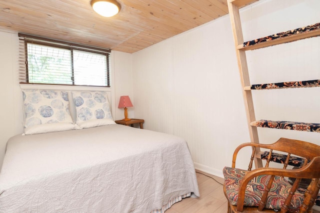 W4943 County Rd S, Horicon, WI 53032 - bedroom with wood ceiling and light wood-style floors