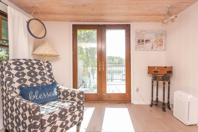 W4943 County Rd S, Horicon, WI 53032 - sitting room with french doors, wood ceiling, plenty of natural light, and wood finished floors
