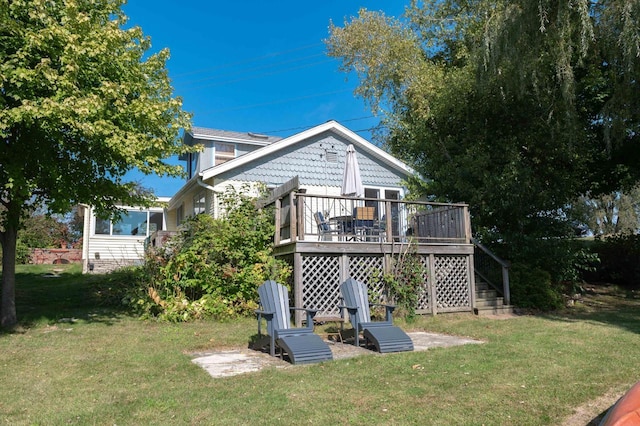 W4943 County Rd S, Horicon, WI 53032 - rear view of house featuring a yard, stairway, and a deck