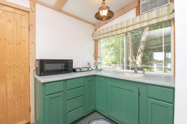W4943 County Rd S, Horicon, WI 53032 - kitchen featuring black microwave, a sink, light countertops, and vaulted ceiling