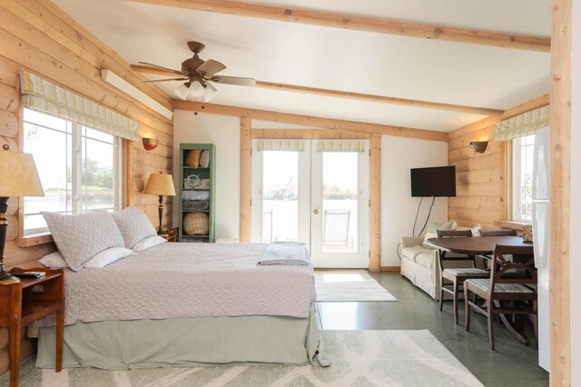 W4943 County Rd S, Horicon, WI 53032 - bedroom featuring wood walls, french doors, access to outside, finished concrete floors, and beamed ceiling