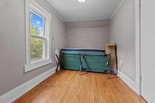 417 E Lincoln Ave, Oshkosh, WI 54901 - bedroom featuring multiple windows, hardwood / wood-style floors, crown molding, and baseboards