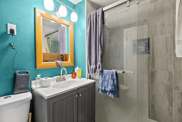 417 E Lincoln Ave, Oshkosh, WI 54901 - bathroom featuring a shower stall, toilet, and vanity