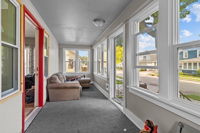 417 E Lincoln Ave, Oshkosh, WI 54901 - sunroom featuring carpet floors and baseboards