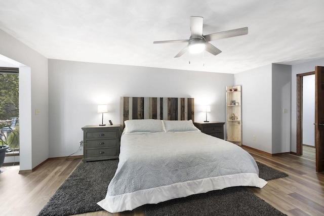 6500 E Decorah Ave, Oshkosh, WI 54902 - bedroom with wood finished floors, ceiling fan, and baseboards