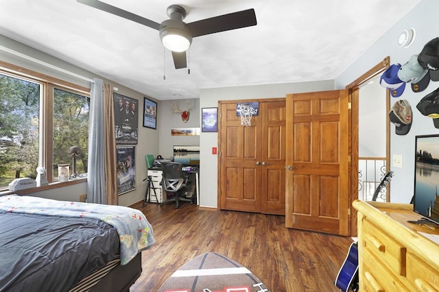 6500 E Decorah Ave, Oshkosh, WI 54902 - bedroom featuring an office area, wood finished floors, and a ceiling fan