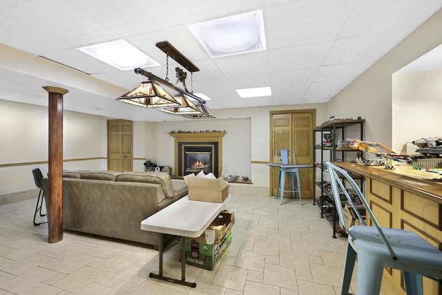 6500 E Decorah Ave, Oshkosh, WI 54902 - living area with a paneled ceiling and a glass covered fireplace