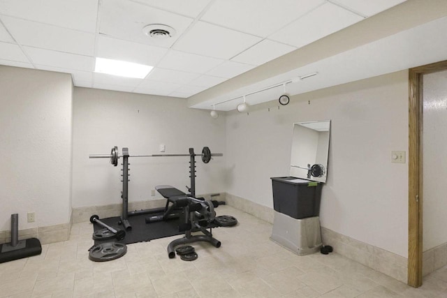 6500 E Decorah Ave, Oshkosh, WI 54902 - workout room featuring baseboards and a drop ceiling