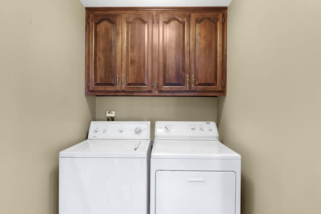 6500 E Decorah Ave, Oshkosh, WI 54902 - laundry room with cabinet space and washer and clothes dryer