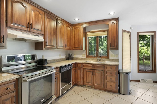 6500 E Decorah Ave, Oshkosh, WI 54902 - kitchen featuring electric range, under cabinet range hood, a sink, black dishwasher, and healthy amount of natural light