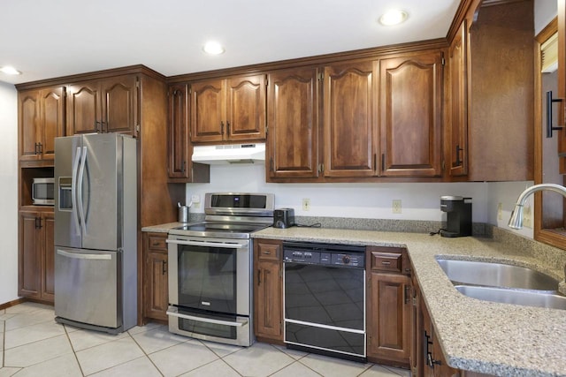 6500 E Decorah Ave, Oshkosh, WI 54902 - kitchen featuring appliances with stainless steel finishes, under cabinet range hood, a sink, recessed lighting, and light tile patterned flooring