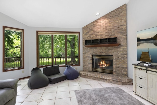 6500 E Decorah Ave, Oshkosh, WI 54902 - living area featuring vaulted ceiling, healthy amount of natural light, tile patterned flooring, and a brick fireplace