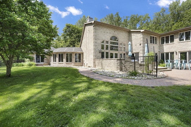 6500 E Decorah Ave, Oshkosh, WI 54902 - back of property with a chimney and brick siding