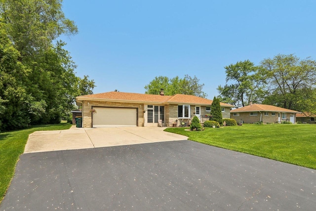 1406 E Oakwood Rd, Oak Creek, WI 53154 - ranch-style house with an attached garage, driveway, stone siding, a front lawn, and a chimney