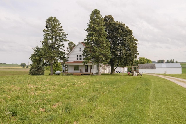 W6497 Vandre Rd, Johnson Creek, WI 53038 - view of front of house with a playground and a front yard