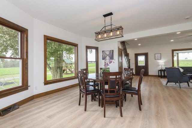 W6497 Vandre Rd, Johnson Creek, WI 53038 - dining space featuring light wood-style floors, baseboards, plenty of natural light, and recessed lighting