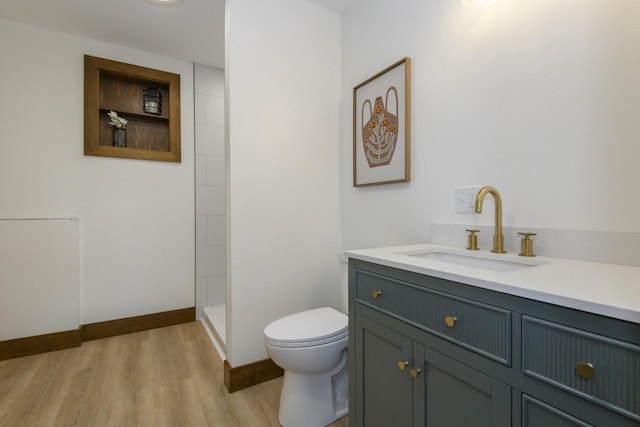 W6497 Vandre Rd, Johnson Creek, WI 53038 - full bath featuring toilet, vanity, wood finished floors, a tile shower, and baseboards