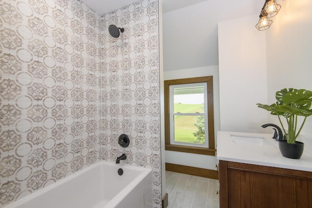 W6497 Vandre Rd, Johnson Creek, WI 53038 - full bathroom featuring vanity, wood finished floors, baseboards, and shower / bathtub combination
