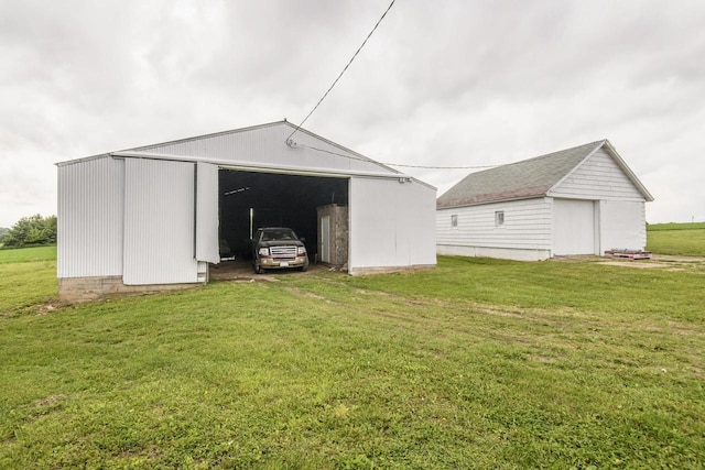 W6497 Vandre Rd, Johnson Creek, WI 53038 - view of pole building with a yard