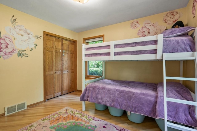 412 Frost Woods Rd, Monona, WI 53716 - bedroom with light wood-style flooring and a closet