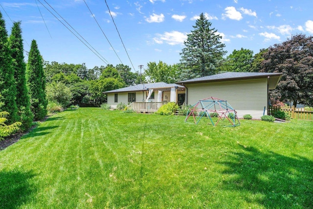 412 Frost Woods Rd, Monona, WI 53716 - view of grassy yard featuring a deck