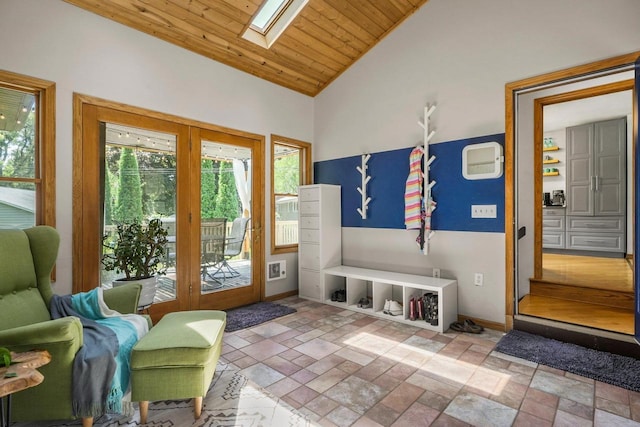 412 Frost Woods Rd, Monona, WI 53716 - living area featuring a skylight, lofted ceiling, stone tile floors, and wood ceiling