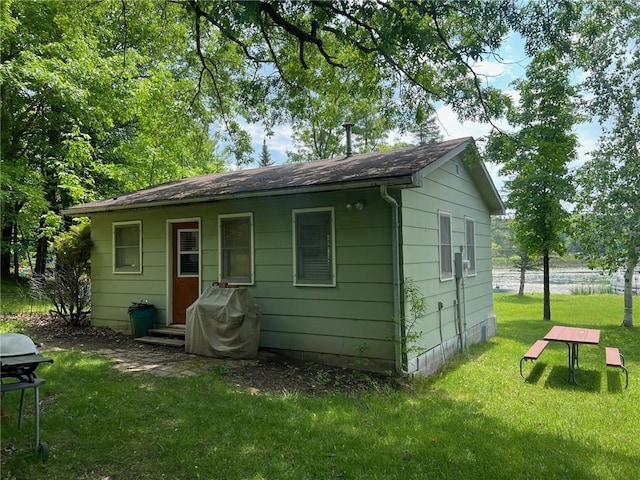 21953 Spirit Lake Access Rd, Frederic, WI 54837 - back of house with a yard and a shingled roof