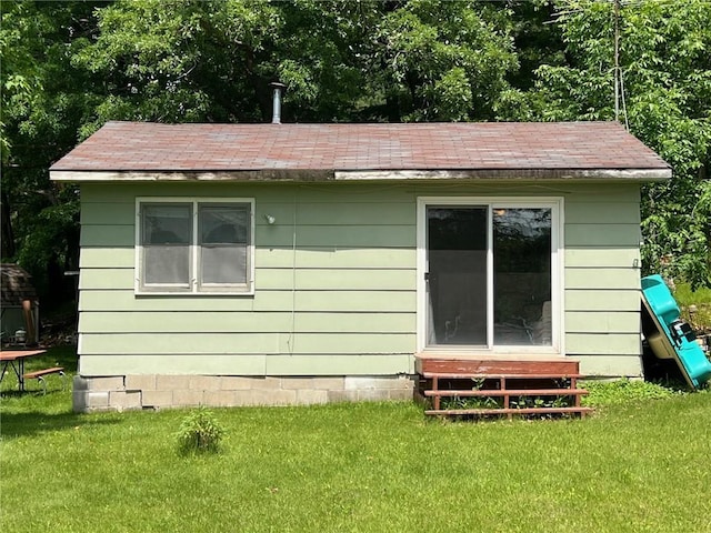 21953 Spirit Lake Access Rd, Frederic, WI 54837 - back of property featuring entry steps and a yard