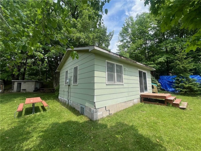 21953 Spirit Lake Access Rd, Frederic, WI 54837 - view of side of property with a yard and an outdoor structure