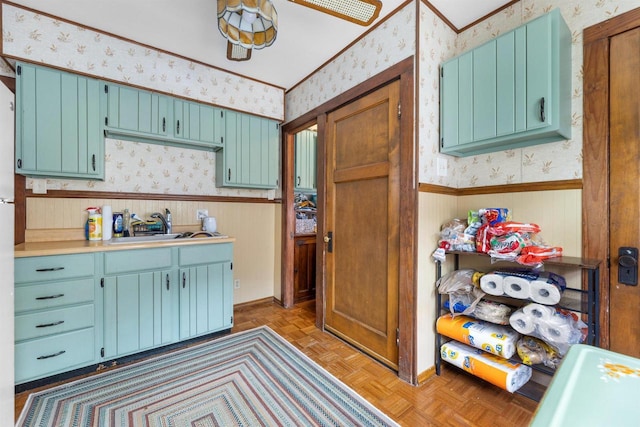 1472 S 86th St, West Allis, WI 53214 - kitchen with wallpapered walls, a wainscoted wall, a sink, and light countertops