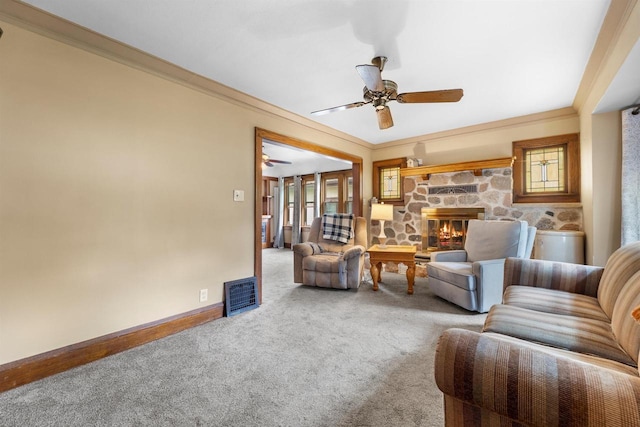 1472 S 86th St, West Allis, WI 53214 - living room featuring ceiling fan, carpet, baseboards, a fireplace, and crown molding