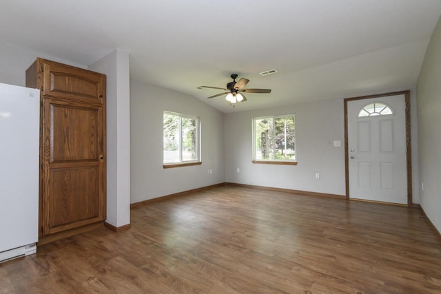 9219 Caddy Ln, Caledonia, WI 53108 - unfurnished living room with ceiling fan, wood finished floors, baseboards, and lofted ceiling