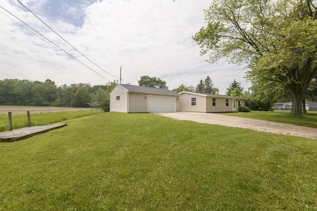 9219 Caddy Ln, Caledonia, WI 53108 - view of green lawn with a detached garage and driveway