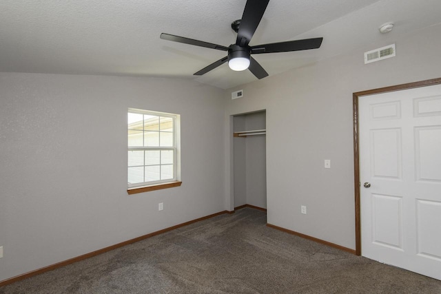 9219 Caddy Ln, Caledonia, WI 53108 - unfurnished bedroom with vaulted ceiling, carpet flooring, a closet, baseboards, and ceiling fan