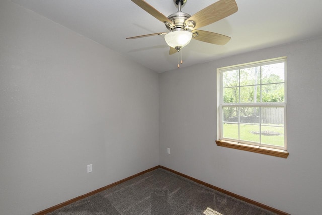 9219 Caddy Ln, Caledonia, WI 53108 - empty room with baseboards, dark carpet, and a ceiling fan