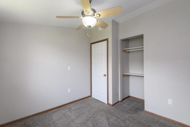 9219 Caddy Ln, Caledonia, WI 53108 - unfurnished bedroom with dark colored carpet, a closet, baseboards, and ceiling fan