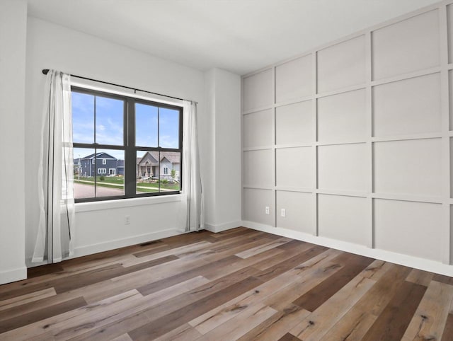 9437 Cobalt St, Middleton, WI 53562 - unfurnished room with wood finished floors and baseboards
