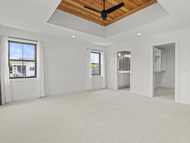 9437 Cobalt St, Middleton, WI 53562 - unfurnished bedroom featuring a tray ceiling, wood ceiling, carpet floors, recessed lighting, and connected bathroom