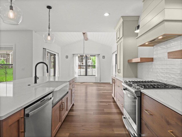 9437 Cobalt St, Middleton, WI 53562 - kitchen featuring stainless steel appliances, custom exhaust hood, backsplash, dark wood finished floors, and light stone countertops