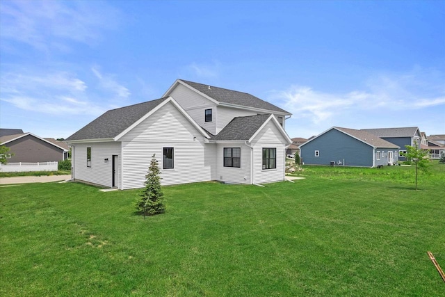 9437 Cobalt St, Middleton, WI 53562 - rear view of house featuring a lawn and a shingled roof