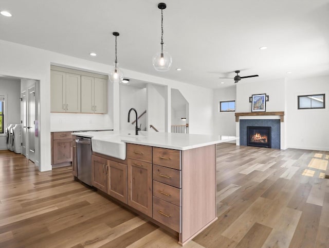 9437 Cobalt St, Middleton, WI 53562 - kitchen featuring dishwasher, recessed lighting, light wood-type flooring, light countertops, and washer / clothes dryer