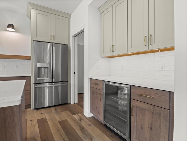 9437 Cobalt St, Middleton, WI 53562 - kitchen with stainless steel fridge with ice dispenser, beverage cooler, wood finished floors, backsplash, and open shelves