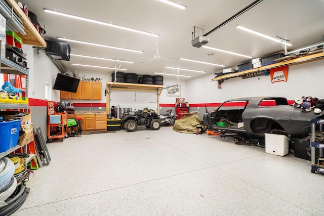 2205 Salisbury Rd, West Bend, WI 53090 - garage featuring a garage door opener and a heating unit