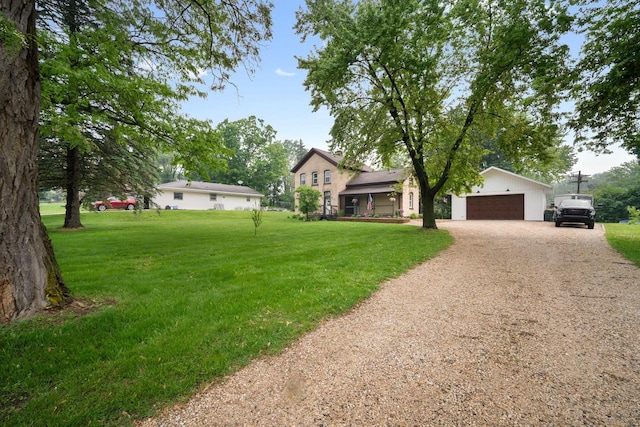 2205 Salisbury Rd, West Bend, WI 53090 - view of front of house with driveway, a front yard, and an attached garage