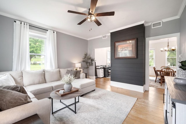 2205 Salisbury Rd, West Bend, WI 53090 - living area featuring ornamental molding, a chandelier, light wood-style flooring, and ceiling fan