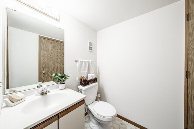 N163W19422 Cedar Run Dr Unit A6, Jackson, WI 53037 - half bathroom featuring vanity, toilet, and baseboards