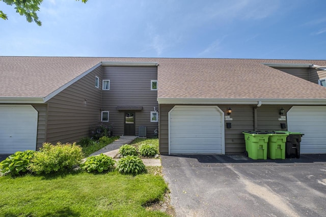 N163W19422 Cedar Run Dr Unit A6, Jackson, WI 53037 - view of front of home with roof with shingles, central AC unit, and asphalt driveway