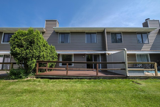 N163W19422 Cedar Run Dr Unit A6, Jackson, WI 53037 - back of property with a chimney, a wooden deck, and a lawn