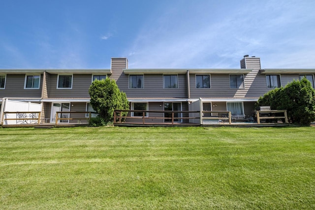 N163W19422 Cedar Run Dr Unit A6, Jackson, WI 53037 - back of house with a chimney, a lawn, and a deck