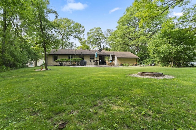 12554 Knoll Rd, Elm Grove, WI 53122 - rear view of property with a fire pit, a lawn, and a patio area